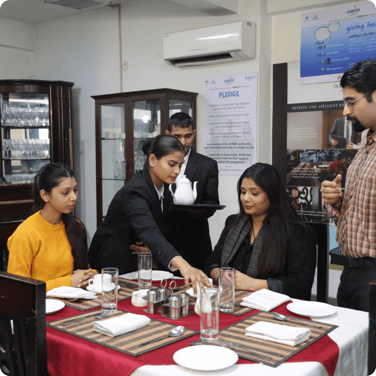 Hospitality trainer giving training to students
